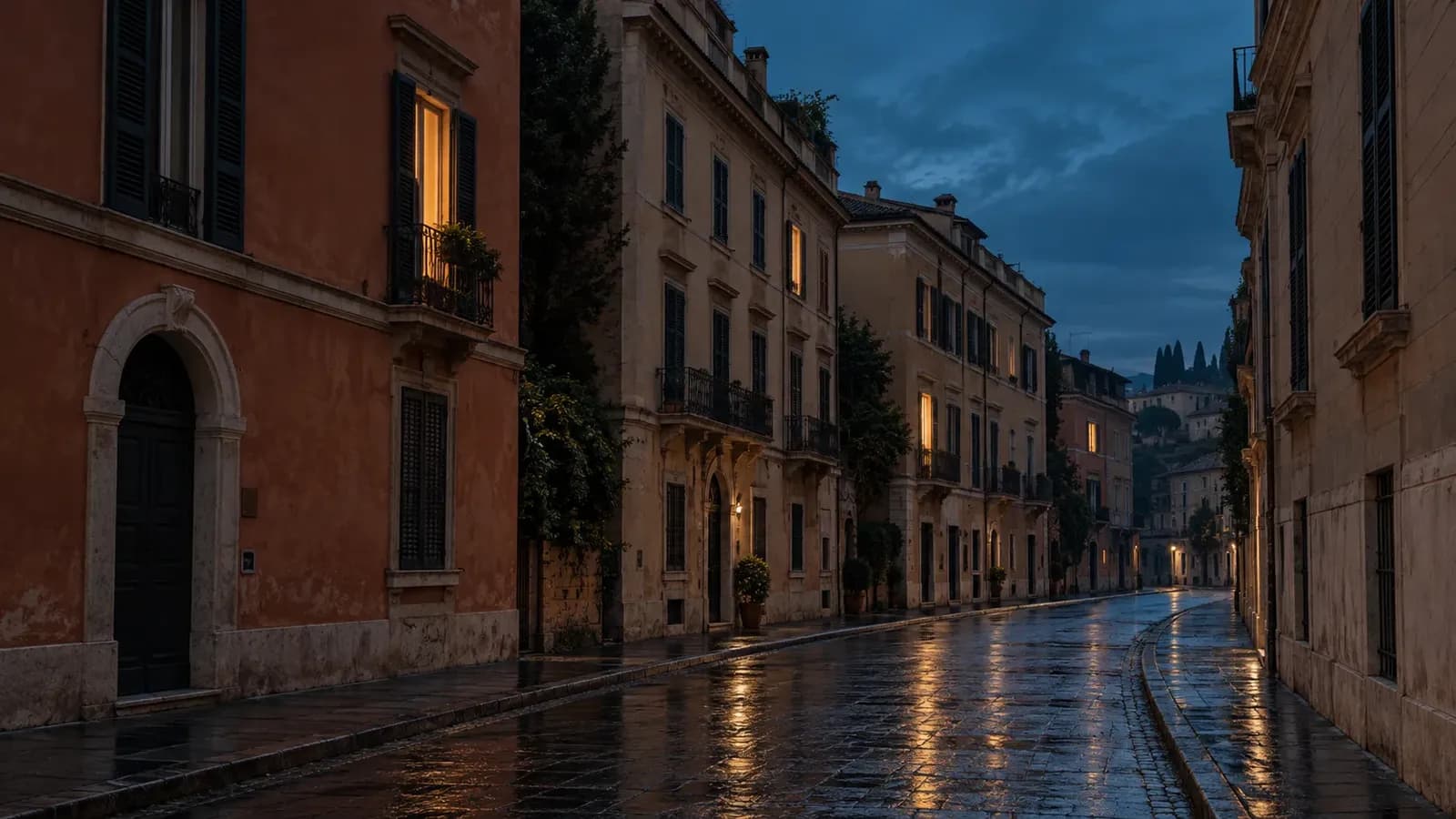 A quiet city street at blue hour with terracotta and sand-coloured buildings, a few warm lit windows, and wet pavement reflecting the glow beneath a teal sky.